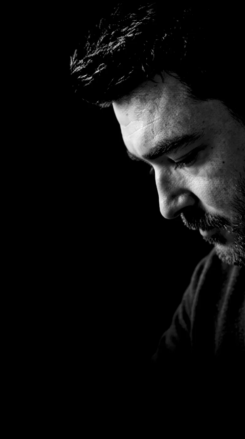 MRCIER, black and white portrait, head bowed